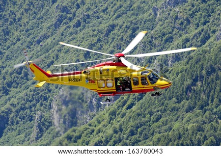 LECCO, ITALY-MAY 28, 2011: An helicopter of Italian red cross in actionn during a rescue operation \