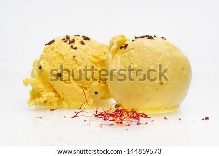 two balls of saffron ice cream with wine salt and olive oil