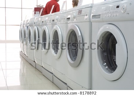 Rows of washing machines in a store