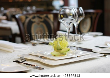 Vegetarian creative food in luxurious restaurant - served table with caramelized pumpkin