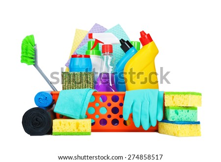 Cleaning supplies in a basket - cleaning and housekeeping concept