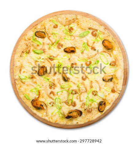 Delicious seafood pizza with shrimps, mussel, olives and leek - thin pastry crust at white background, above view