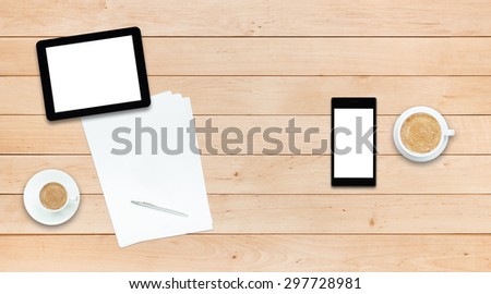 Two gadgets - smartphone and tablet PC and paper sheets with pen and coffee cups on a wooden table, business, study for couple concept
