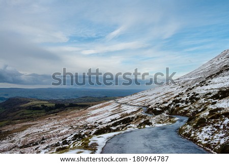 A road along the side of a mountain in the Brecon Beacons