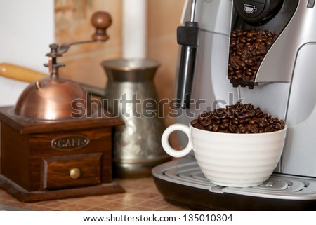 The full cup of coffee grains standing in the coffee machine gun
