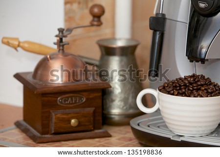 The full cup of coffee grains standing in the coffee machine gun