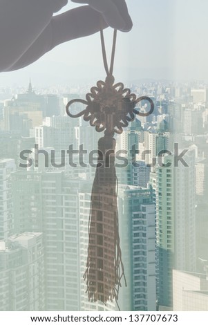 Holding Chinese Knot, Day City View