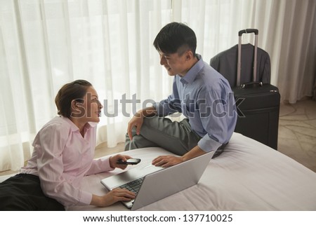Business couple in hotel room