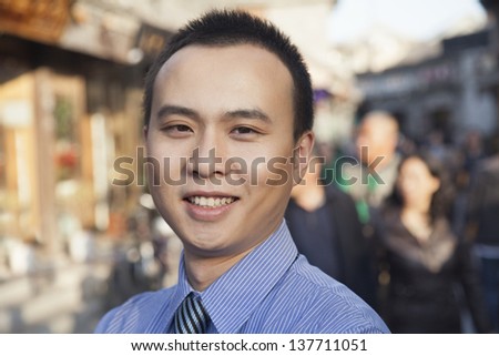 Portrait of young business man in Houhai, Beijing, China