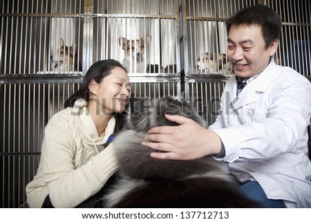 Woman with pet dog and veterinarian