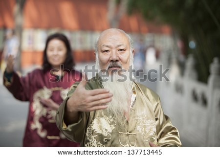 Two Chinese People Practicing Tai Ji