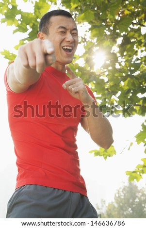 Young Muscular Man Pointing at Camera