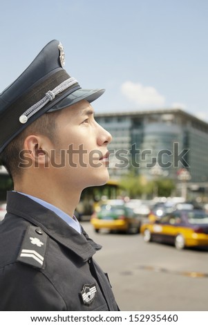Police Officer looking up, profile
