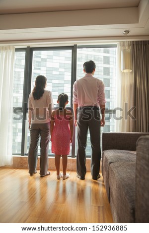 family looking through the window