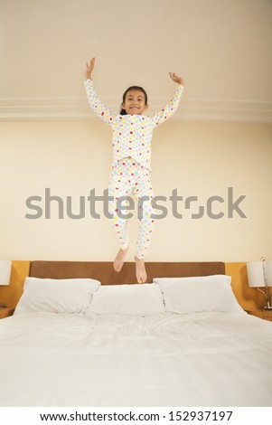 Kid Jumping on Bed