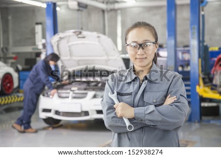 Proud Female Mechanic with Colleague