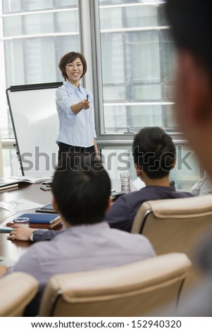 Woman Giving Business Presentation