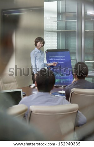 Woman Giving Business Presentation
