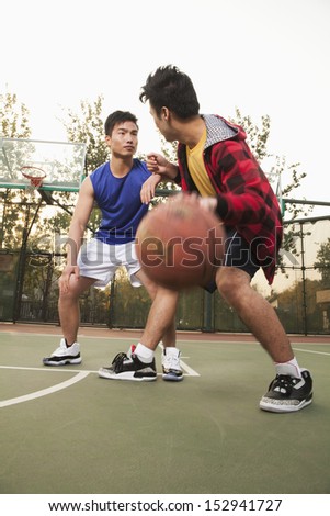 Two street basketball players on the basketball court