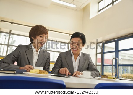 Two person meeting in company cafeteria