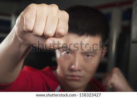 Close up of boxer throwing punch at camera