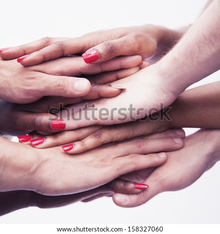 Close-up on a pile of hands on top of each other