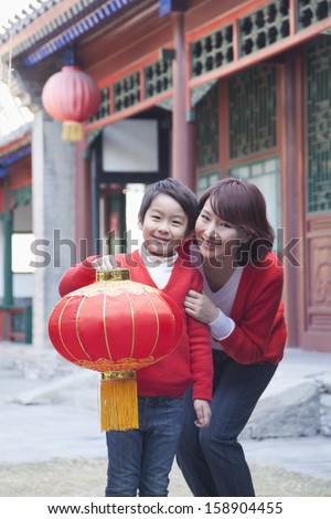 Mother and son holding Chinese lantern