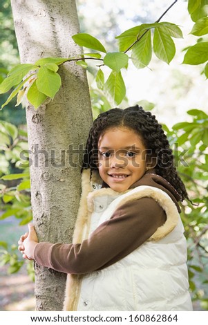 Girl holding tree