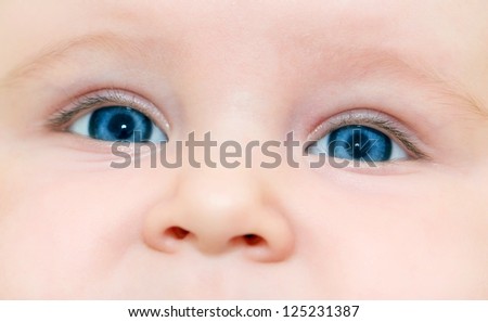 face of nice blue-eyed baby close up