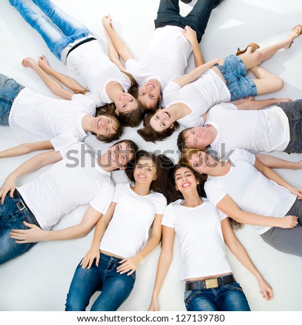 young people lie over white background