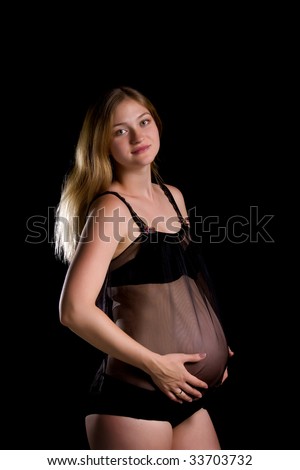 stock photo Sexy pregnant woman Isolated on black background