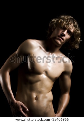 stock photo Beautyful nude man on a black background