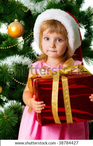 Cute girl with xmas gifts. Isolated on wite