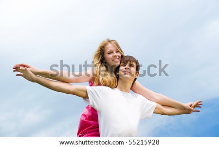 stock photo : Couple holding hands. Sky as background