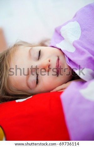 Cute sleep girl on the bed