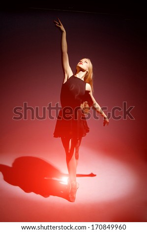 a young wonderful ballerina is dancing gracefully