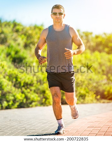 Running athlete. Male runner outdoors