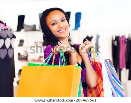 Beautiful  latin american women with packages shopping