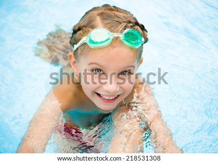 smiling little girl in swimming pool