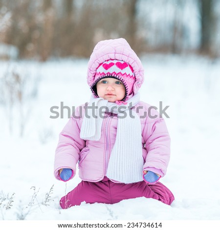 first snow. little girl enjoys the arrival of winter