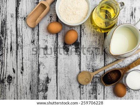 food ingredients on a wooden background with space for text