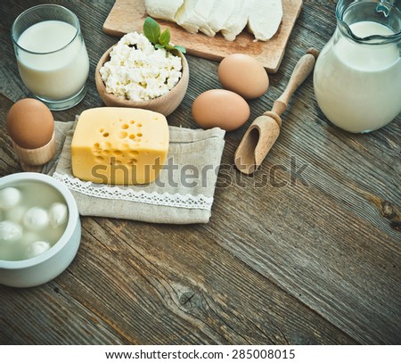 milk products on old wooden table. top view