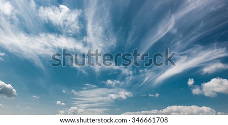 White clouds in a blue fantastic sky. Great background. horizontal