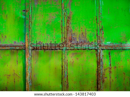Rusty green painted metal wall with cracked paint, texture color grunge background
