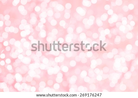 Colorful background with natural bokeh texture and defocused sparkling lights. Turquoise and pink texture with background with twinkling lights. Vintage and pastel colors