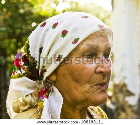 Portrait of old lady in shawl.