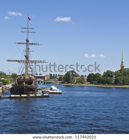 St. Petersburg, Russia, sailing ship on river Neva and top of fortress of St. Peter and Pavel.