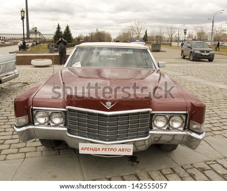 MOSCOW - APRIL 21: retro car cadillac on rally of classical cars on Poklonnaya hill,  April 21, 2013, in town Moscow, Russia, unidentified people looking at rally.
