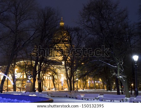 Orthodox cathedral of St. Isaac in winter illuminated at night in St. Petersburg, Russia.