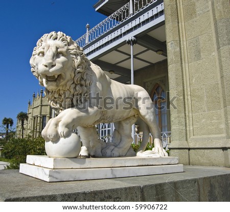 Stone sculpture of lion near Vorontcovskiy palace in town Alupka region Crimea on Black sea coast.